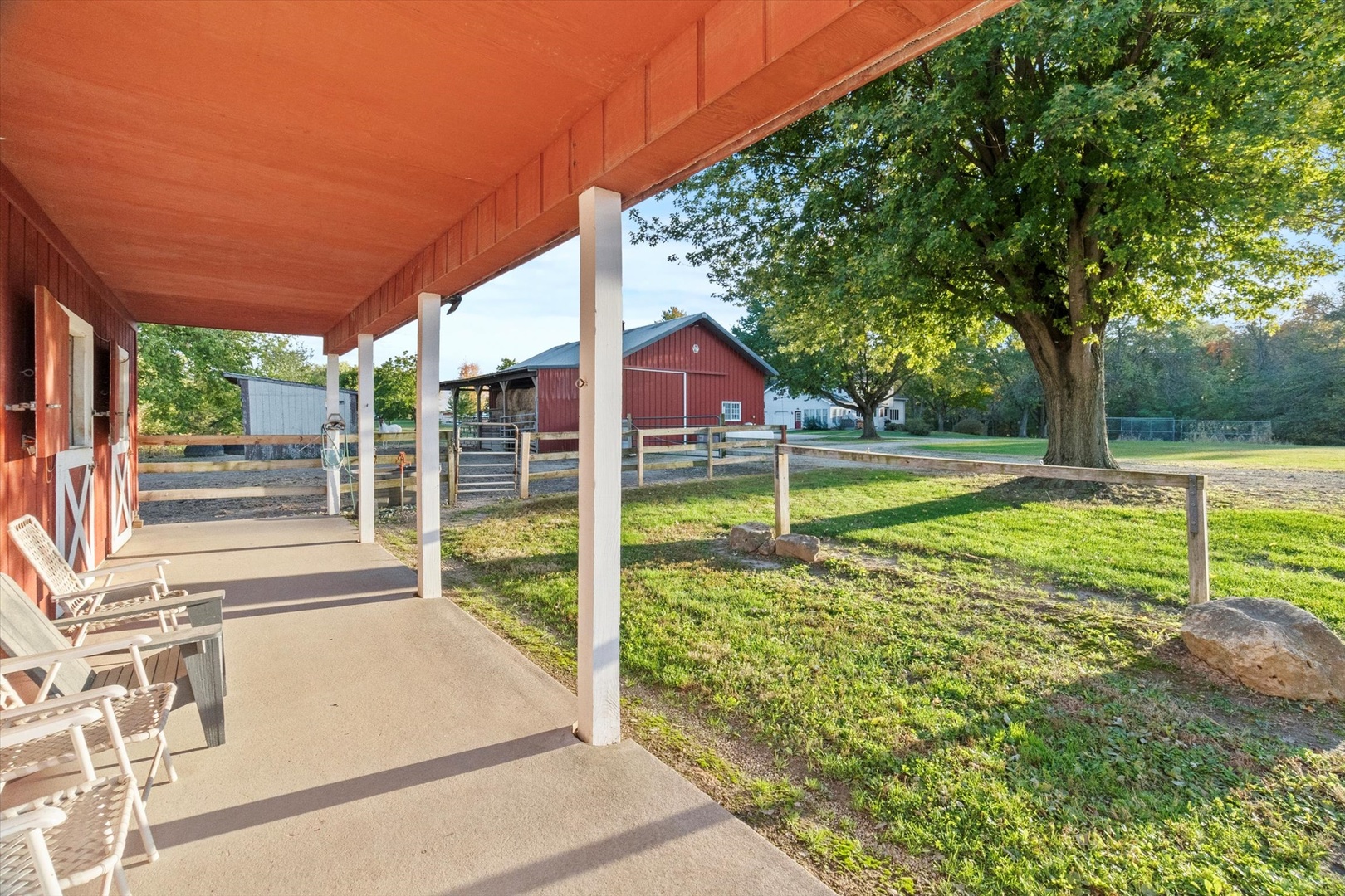 15344 Norrish Road Morrison, IL 61270 - Photo 44 of 50 a view of a house with a big yard and a large tree