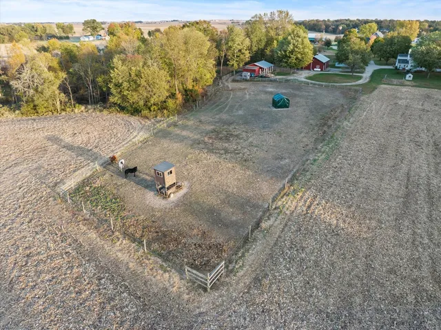 an aerial view of a house with outdoor space