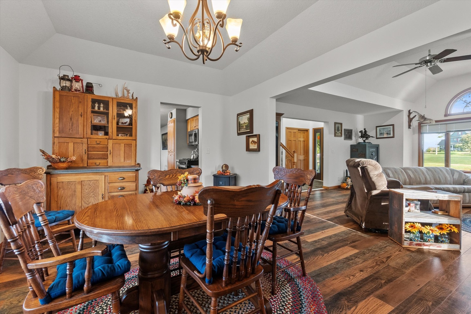 15344 Norrish Road Morrison, IL 61270 - Photo 7 of 50 a view of a dining room with furniture a chandelier and wooden floor