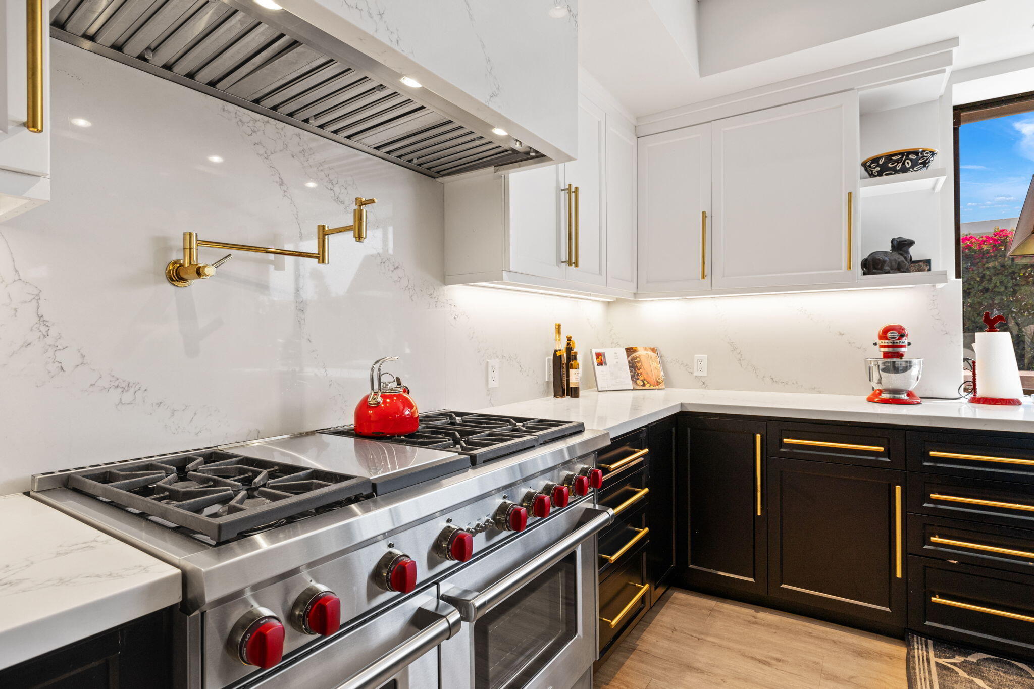 7 Big Sioux Road Rancho Mirage, CA 92270 - Photo 17 of 64 a kitchen with stainless steel appliances a sink a stove and cabinets