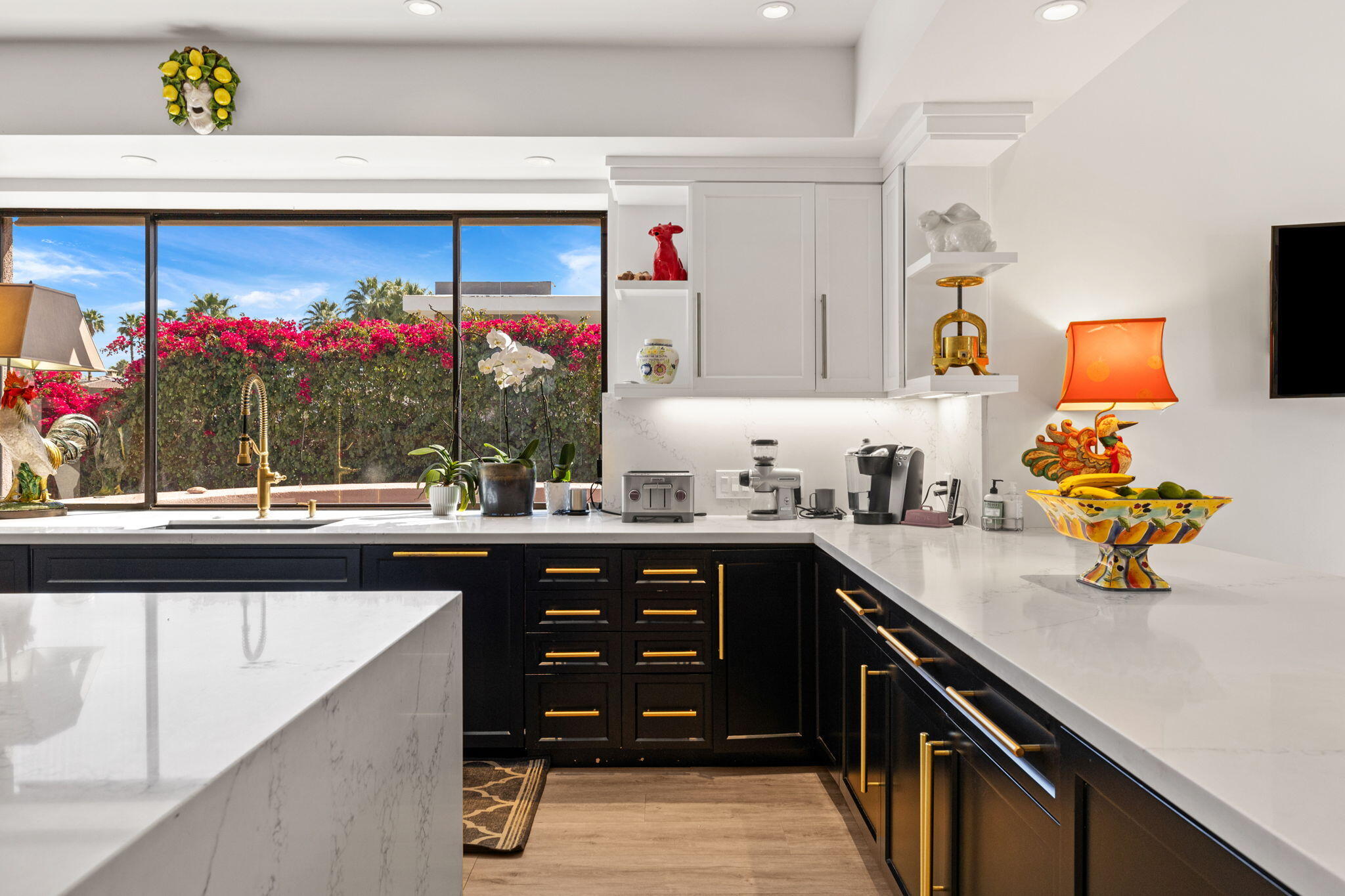 7 Big Sioux Road Rancho Mirage, CA 92270 - Photo 18 of 64 a kitchen with a sink and cabinets