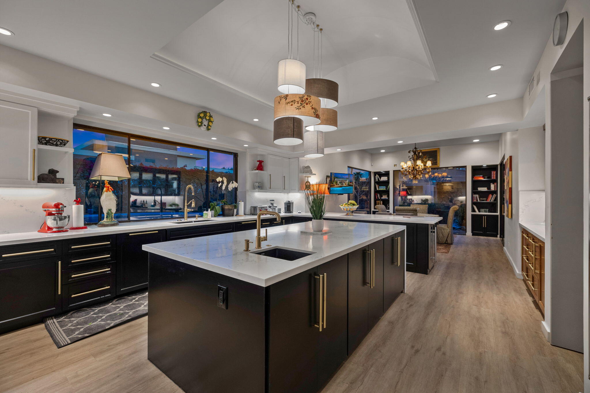 7 Big Sioux Road Rancho Mirage, CA 92270 - Photo 19 of 64 a kitchen with stainless steel appliances granite countertop a sink and a refrigerator