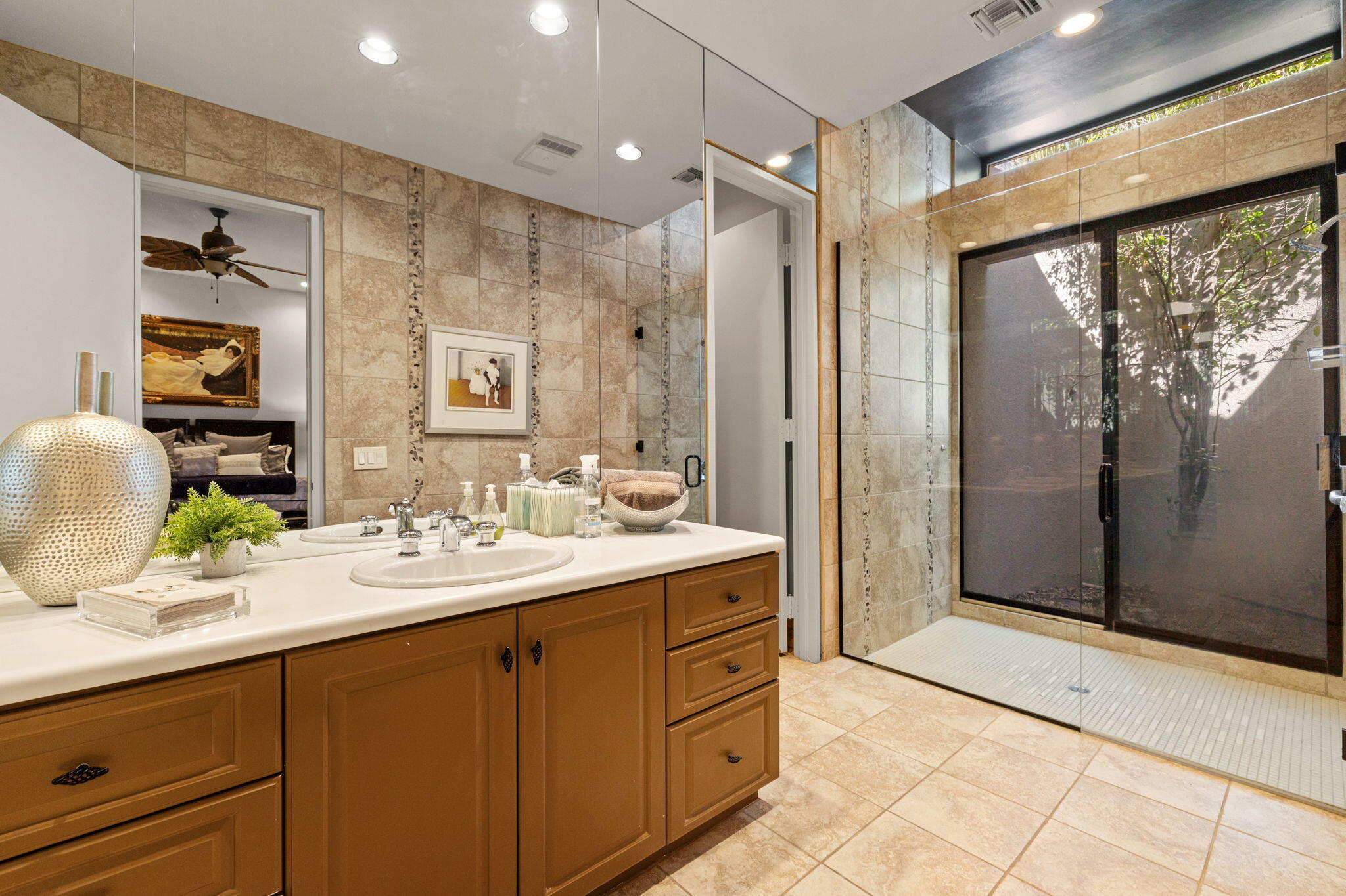7 Big Sioux Road Rancho Mirage, CA 92270 - Photo 28 of 64 a spacious bathroom with a double vanity sink mirror and shower