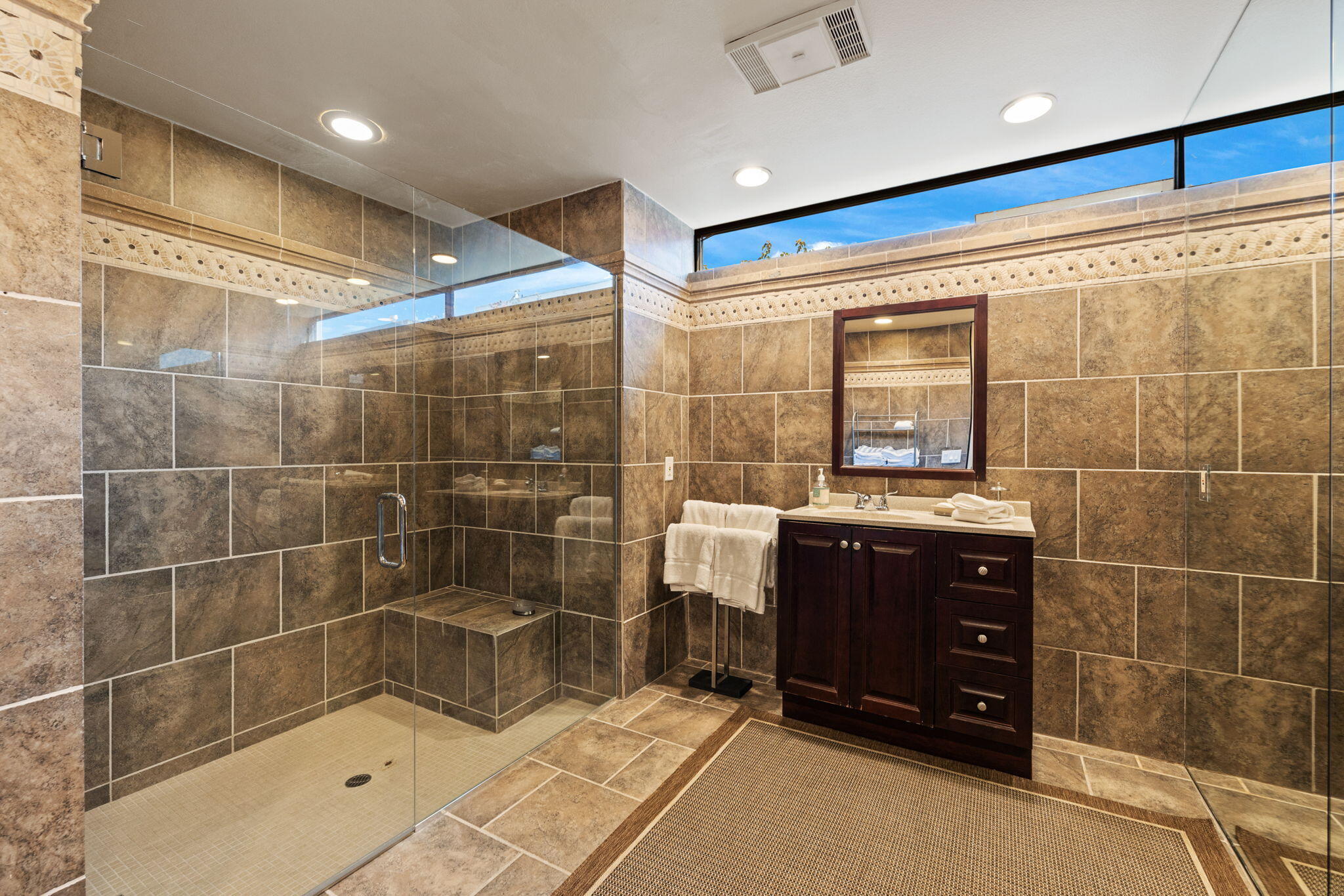 7 Big Sioux Road Rancho Mirage, CA 92270 - Photo 38 of 64 a bathroom with a glass door shower and a sink