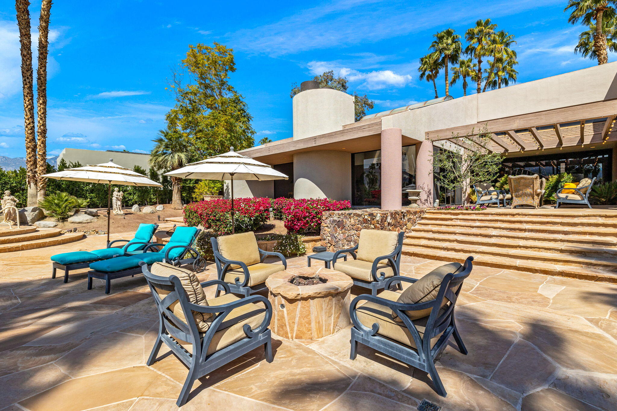 7 Big Sioux Road Rancho Mirage, CA 92270 - Photo 45 of 64 a view of a chairs and table in patio with a fire pit