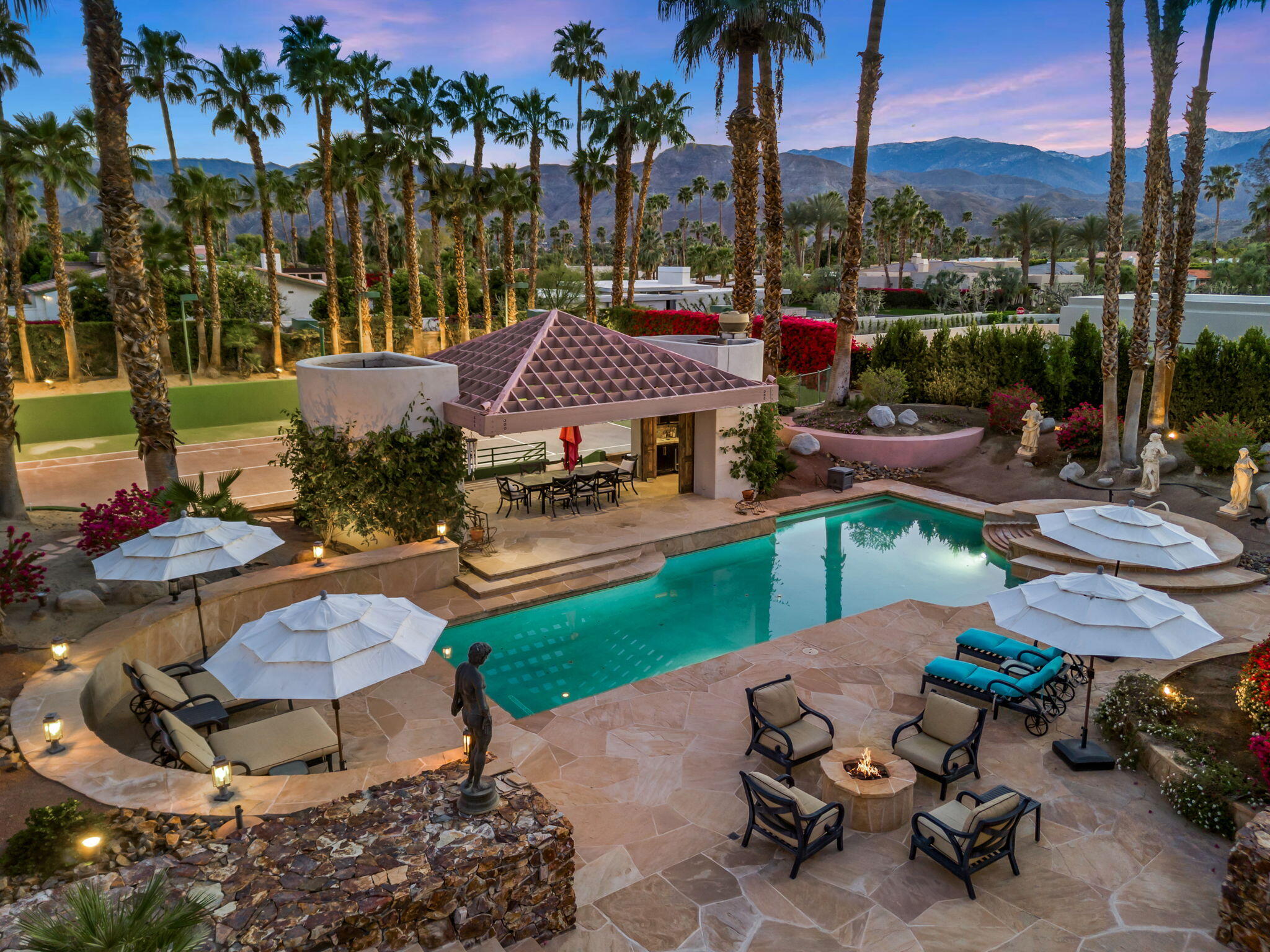 7 Big Sioux Road Rancho Mirage, CA 92270 - Photo 49 of 64 a view of a backyard with sitting area and outdoor seating