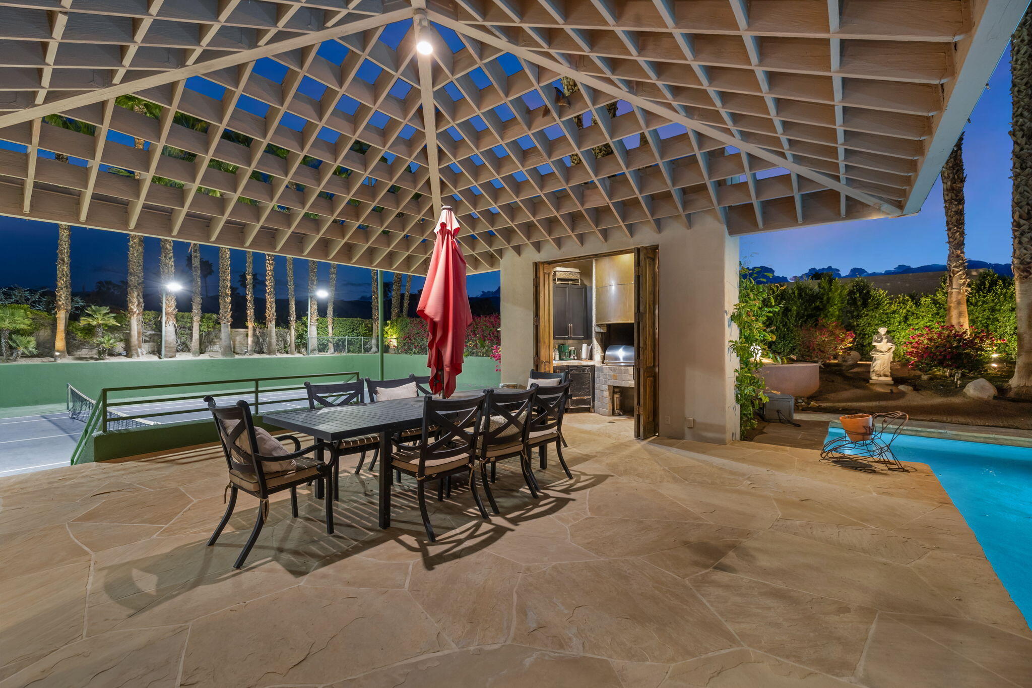7 Big Sioux Road Rancho Mirage, CA 92270 - Photo 51 of 64 a view of a patio with table and chairs and potted plants