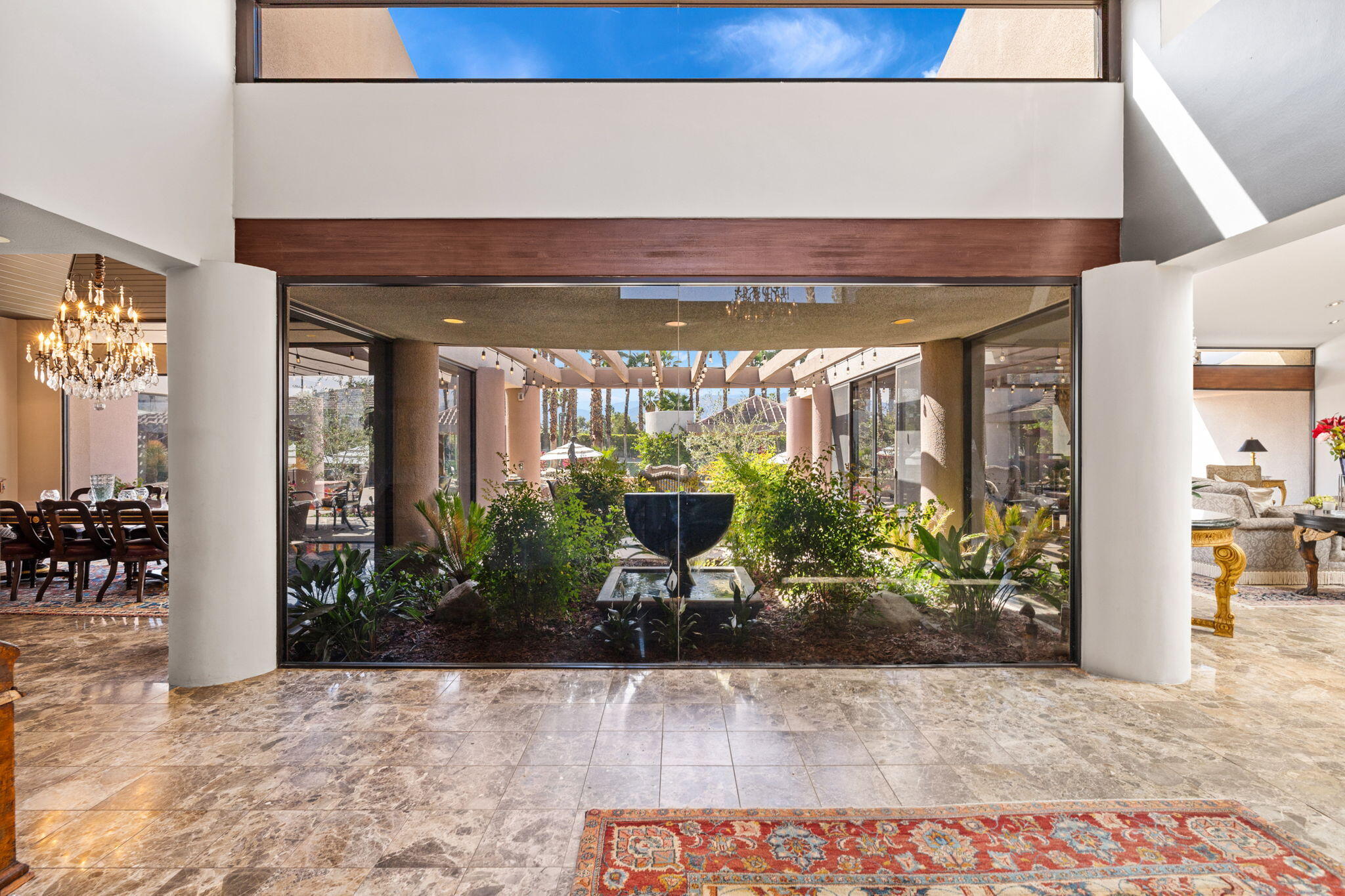 7 Big Sioux Road Rancho Mirage, CA 92270 - Photo 6 of 64 a view of a entryway door with potted plants