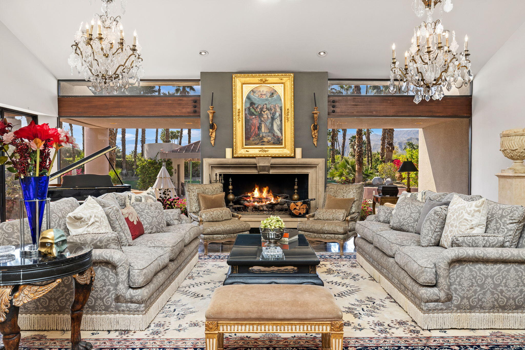 7 Big Sioux Road Rancho Mirage, CA 92270 - Photo 8 of 64 a living room with furniture a chandelier and a fireplace