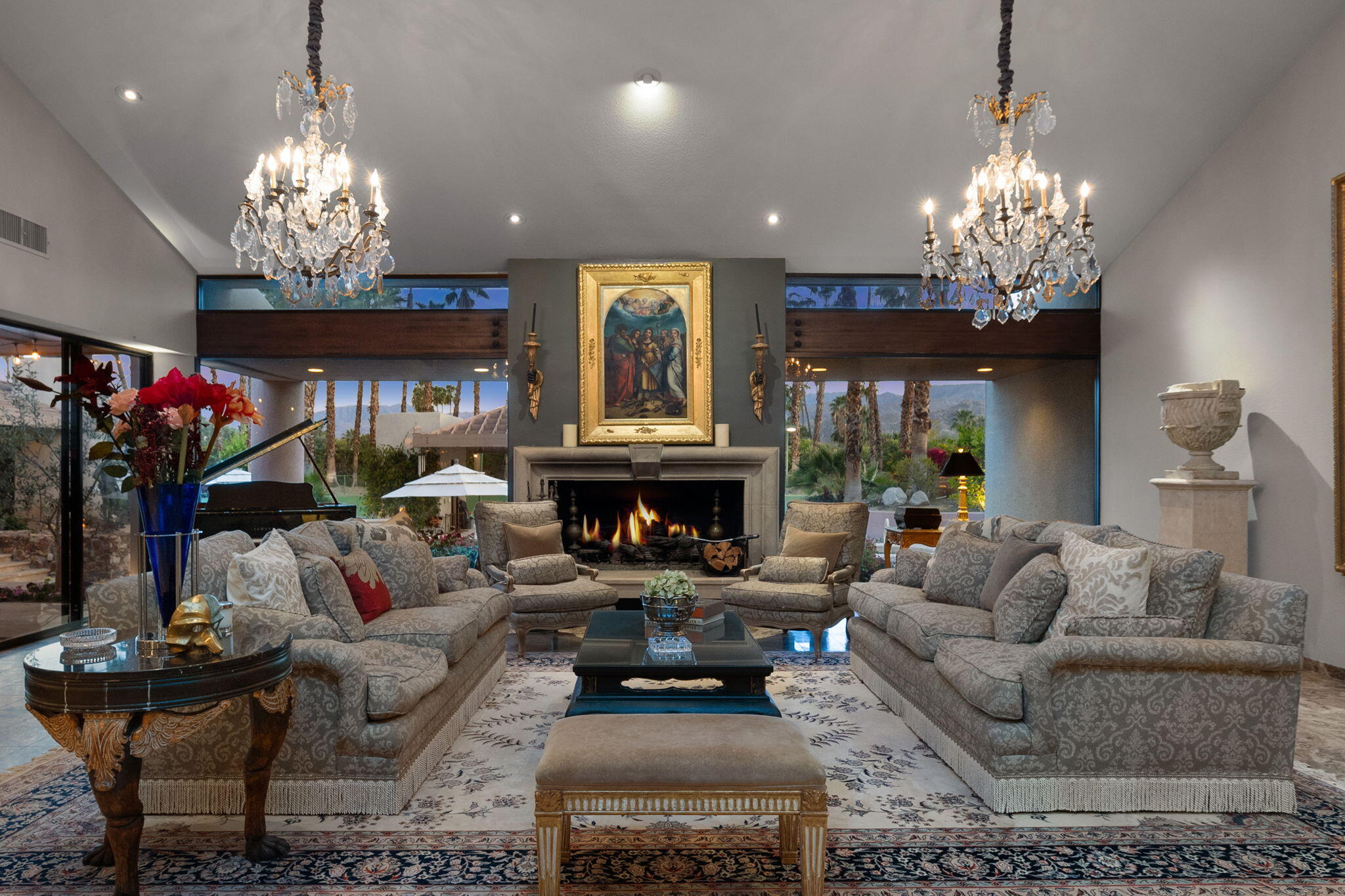 7 Big Sioux Road Rancho Mirage, CA 92270 - Photo 9 of 64 a living room with furniture a chandelier and a fireplace