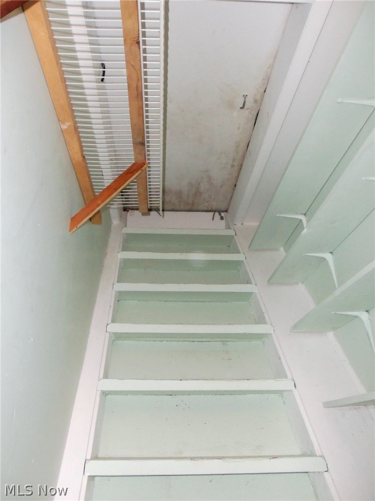 16850 Old State Road Middlefield, OH 44062 - Photo 13 of 23 Stairs in closet leads to floored attic for extra storage...