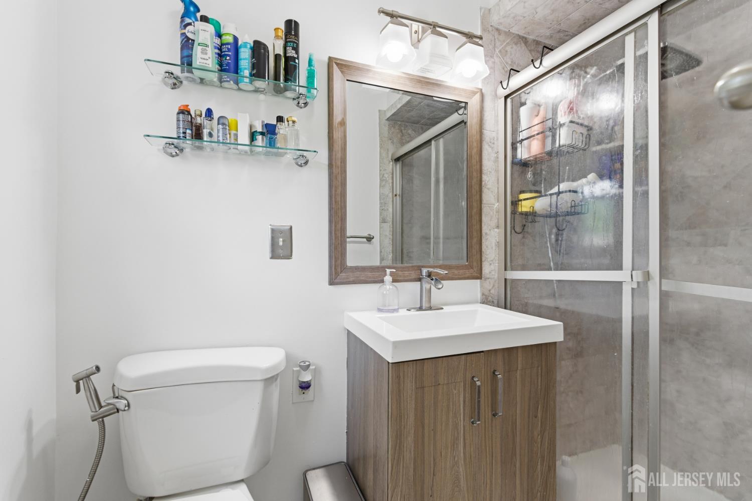 213 Normandy Road Edison, NJ 08820 - Photo 29 of 45 a bathroom with a sink a toilet and shower