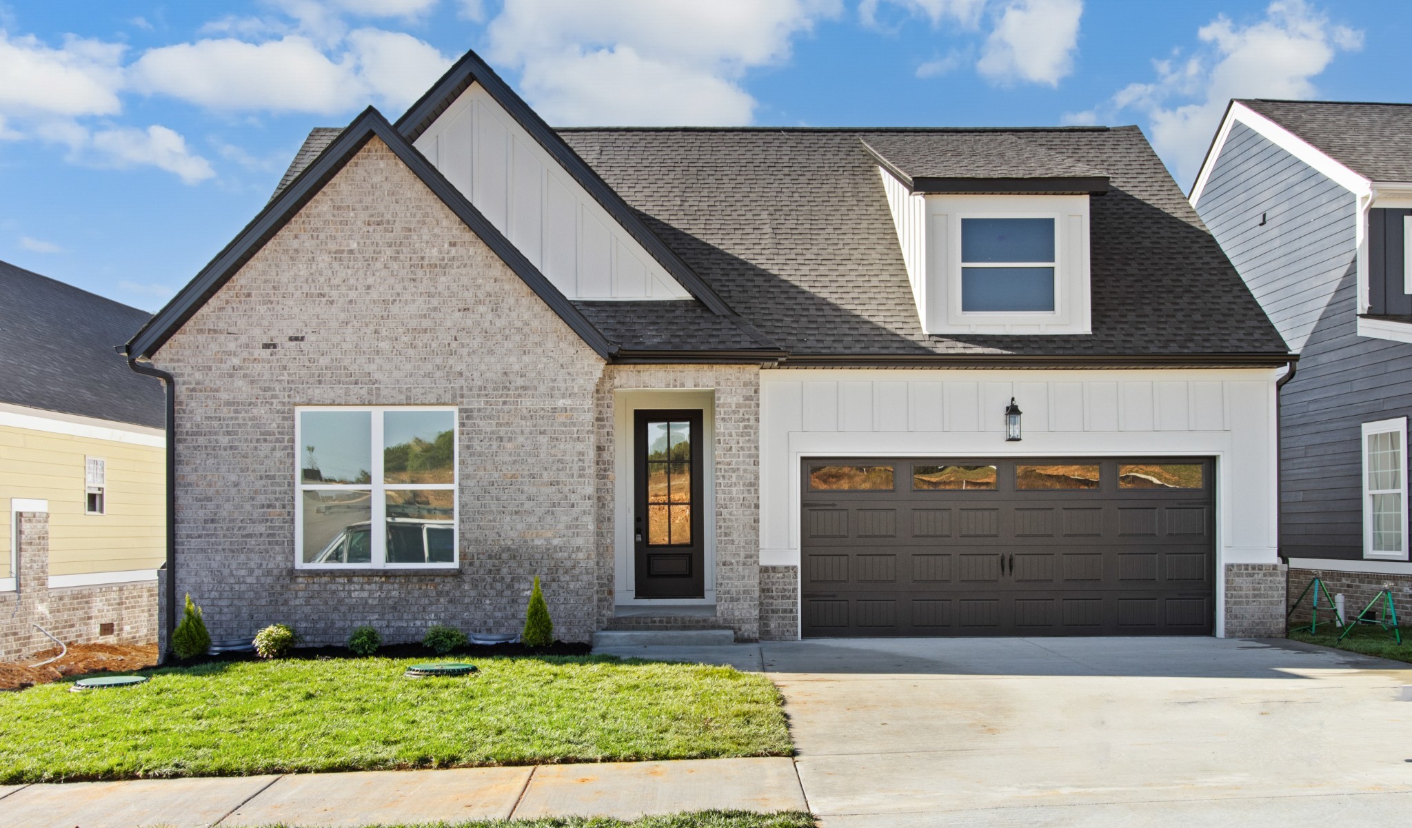 a front view of a house with garage