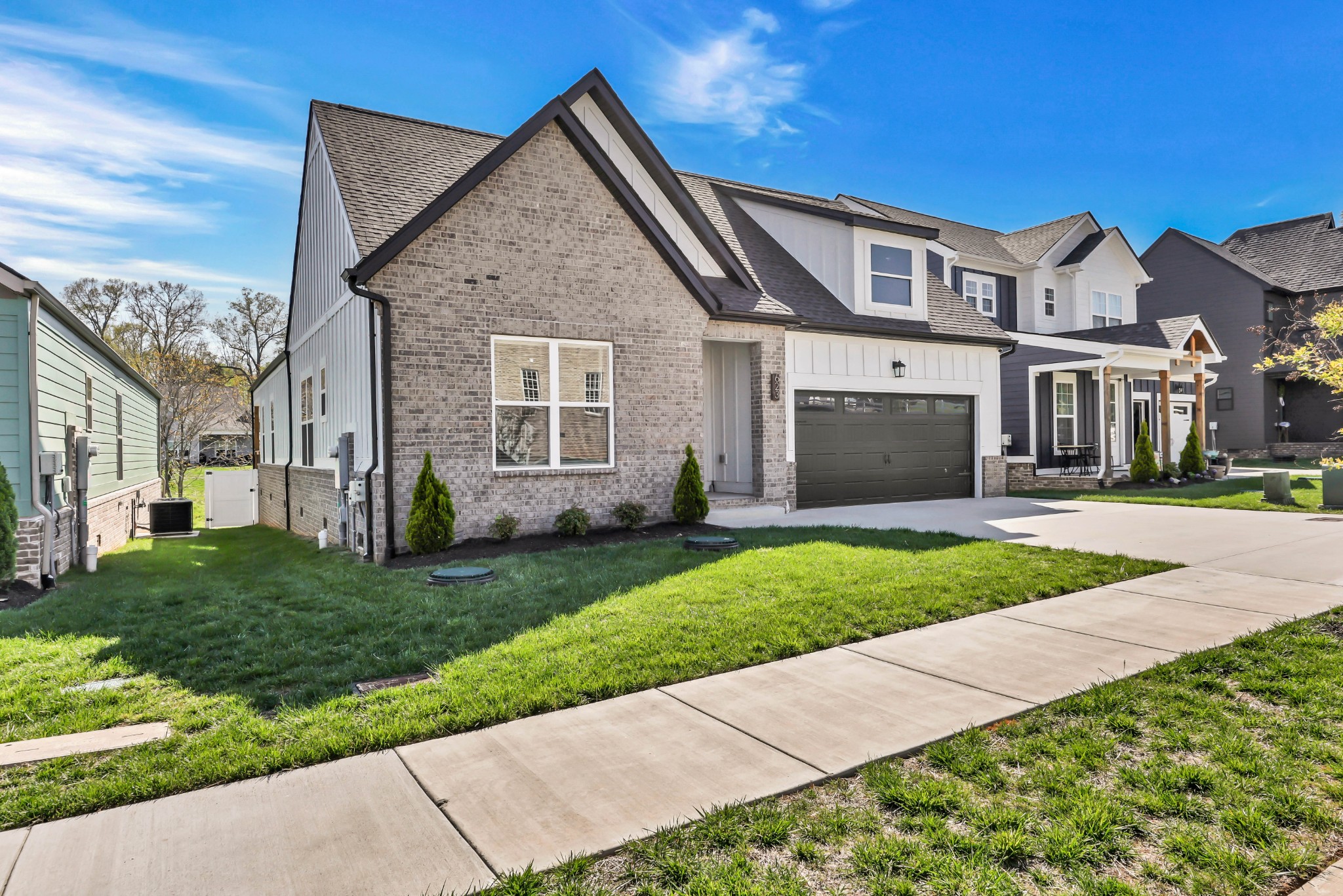 623 Centre Street Pleasant View, TN 37146 - Photo 2 of 53 a front view of a house with a yard and garage