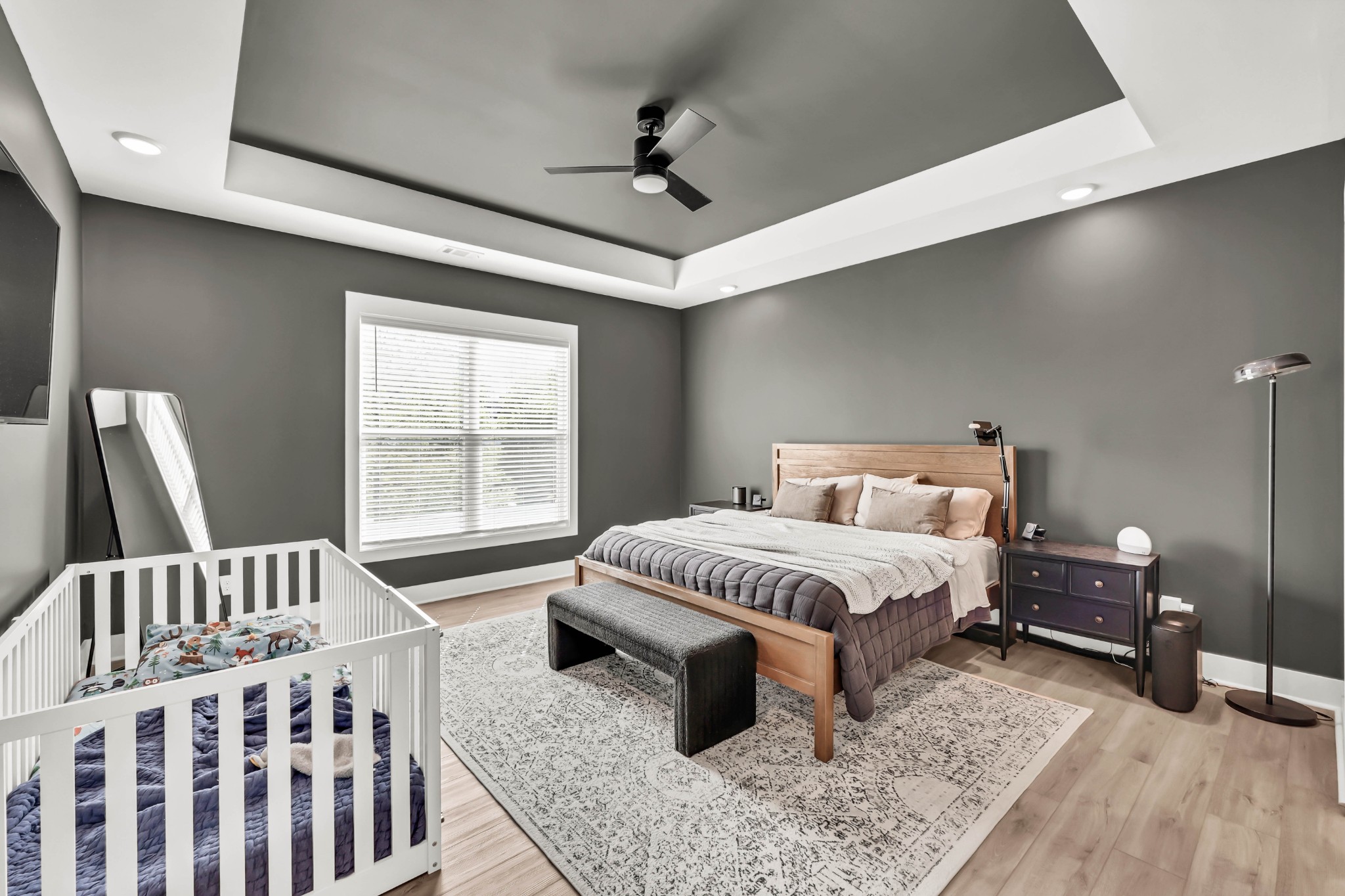 623 Centre Street Pleasant View, TN 37146 - Photo 22 of 53 a spacious bedroom with a bed a couch and a window