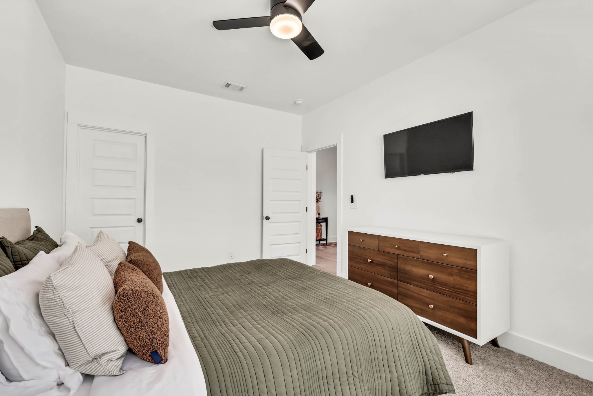 623 Centre Street Pleasant View, TN 37146 - Photo 34 of 53 a bedroom with a bed and a flat screen tv