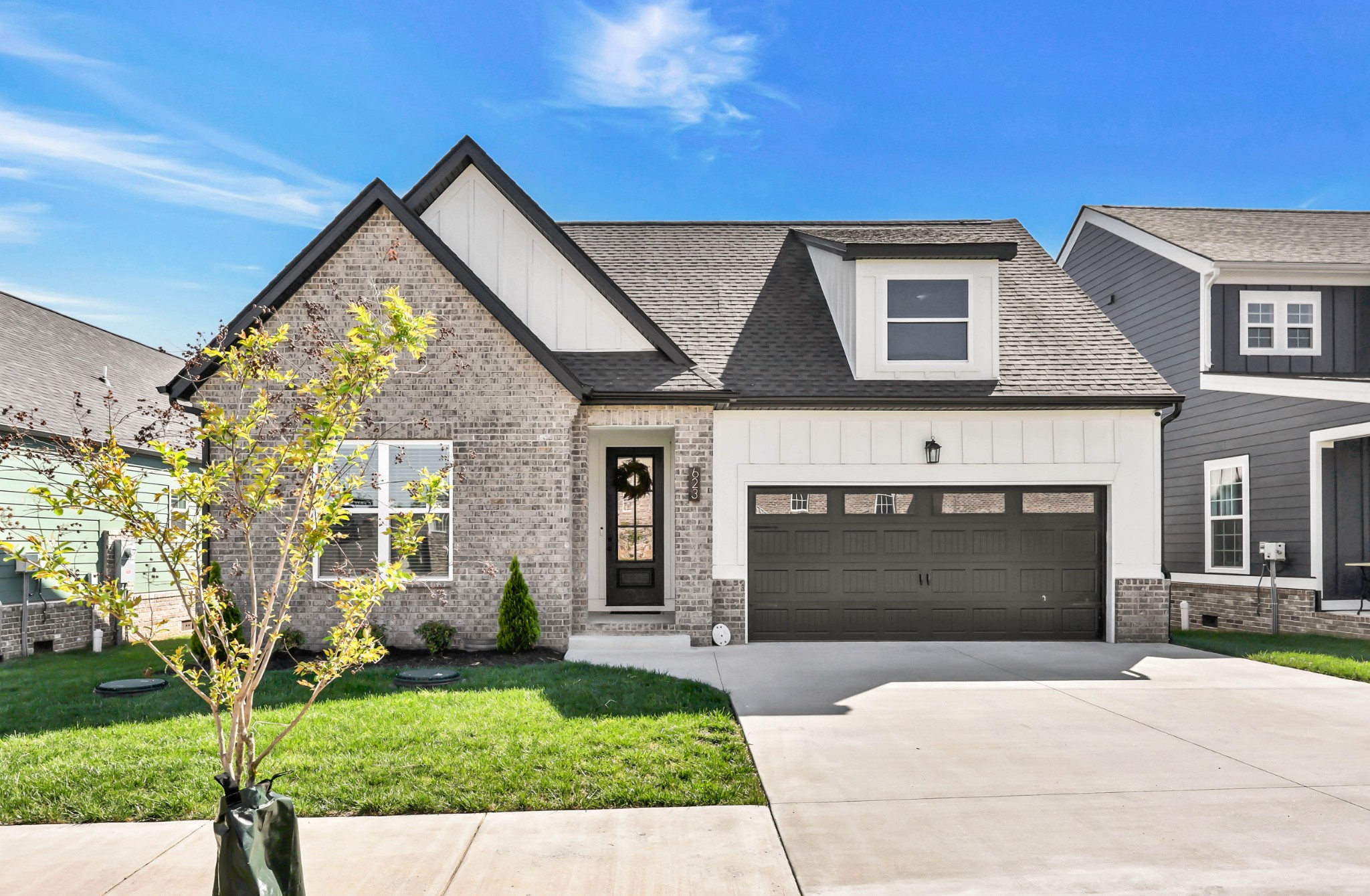 623 Centre Street Pleasant View, TN 37146 - Photo 39 of 53 a front view of a house with a yard and garage