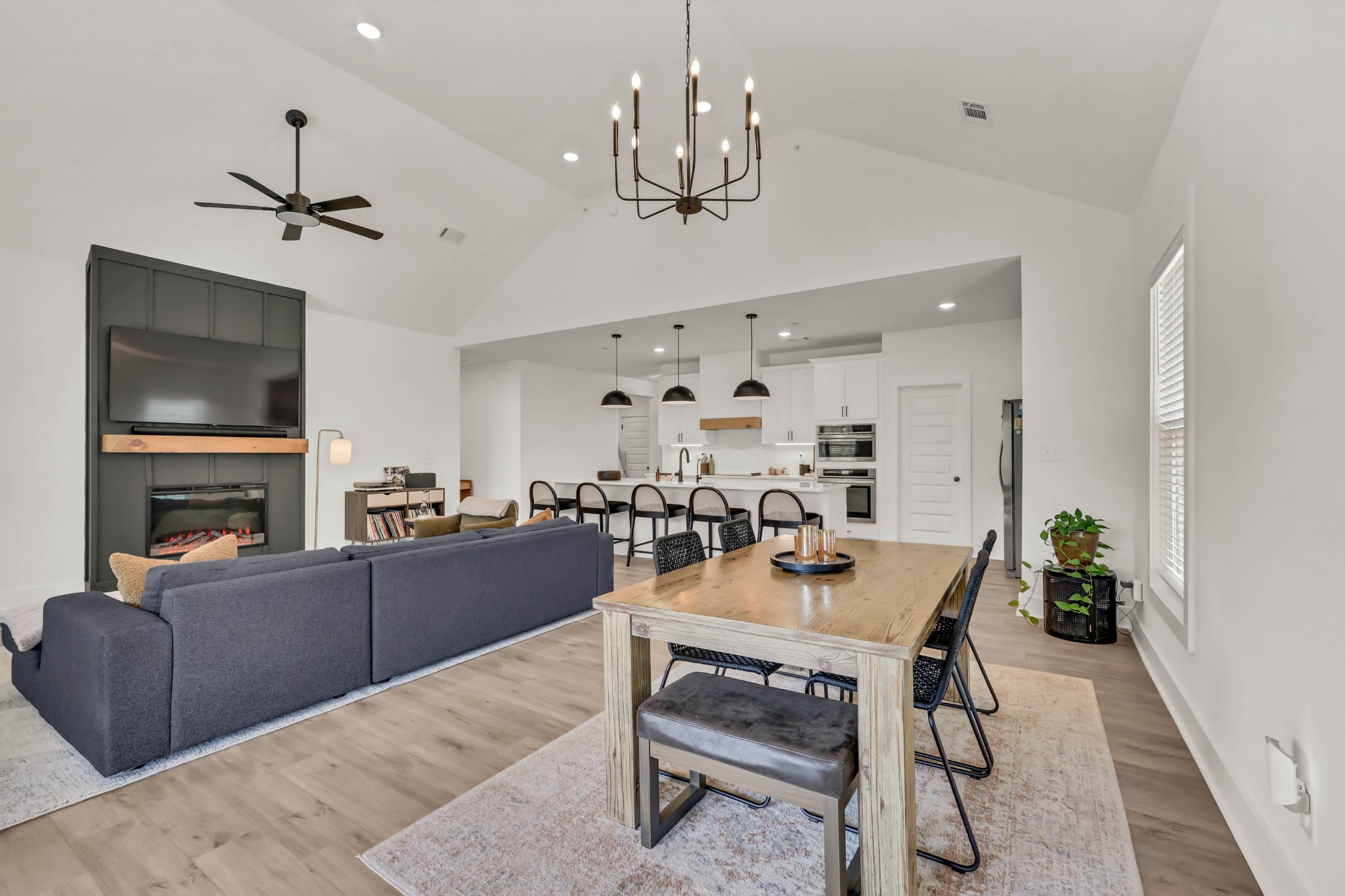 623 Centre Street Pleasant View, TN 37146 - Photo 10 of 53 a living room with furniture a chandelier and a flat screen tv