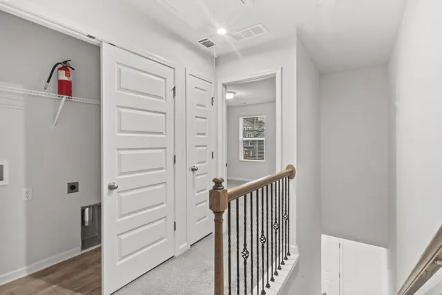 a view of a hallway with front door