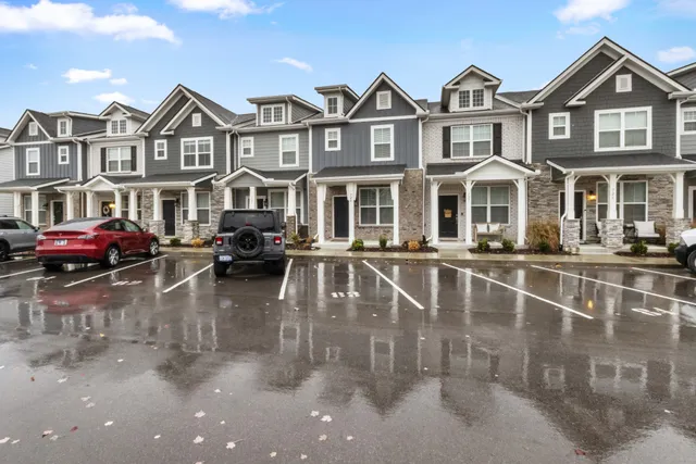 a view of a brick building with many windows