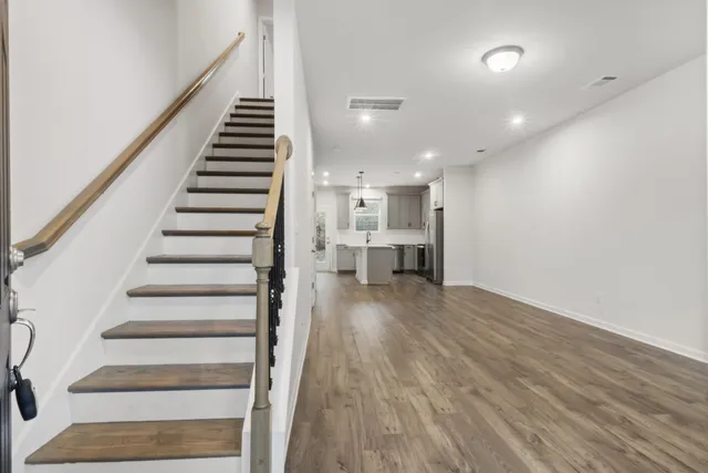 a view of entryway with wooden floor