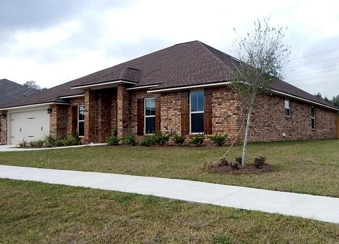 4748 Chanson Crossing Crestview, FL 32539 - Photo 1 of 1 a view of a house with a yard and large tree
