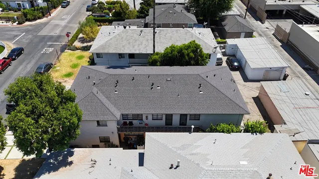 an aerial view of a city with lots of residential and mountain view