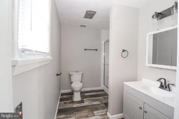 a bathroom with a sink toilet and vanity