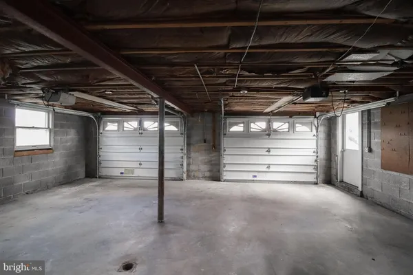 a view of empty room with wooden ceiling