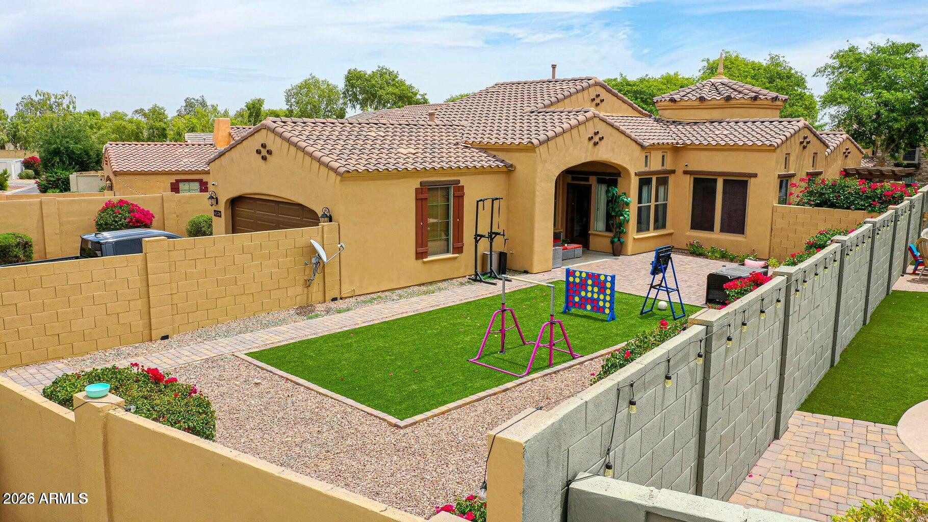 3950 North Edith Way Buckeye, AZ 85396 - Photo 30 of 32 a front view of a house with a yard