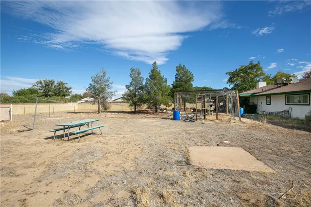 a view of a house with outdoor space and sitting area