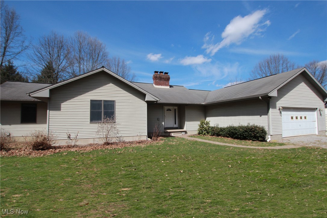 1031 Georgetown Road Salem, OH 44460 - Photo 1 of 31 Ranch-style house featuring a chimney, a front yard, and an attached garage
