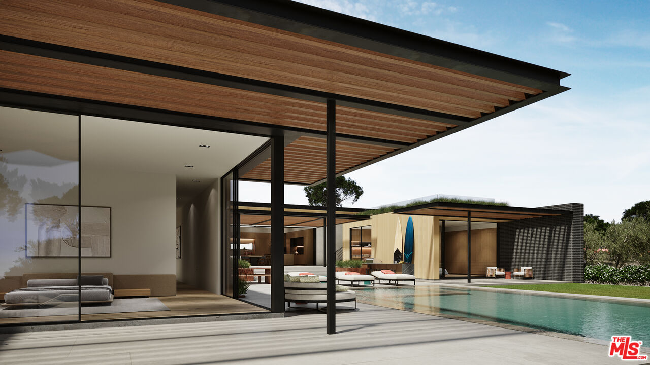 29636 Cuthbert Road Malibu, CA 90265 - Photo 13 of 30 a patio with a table and chairs