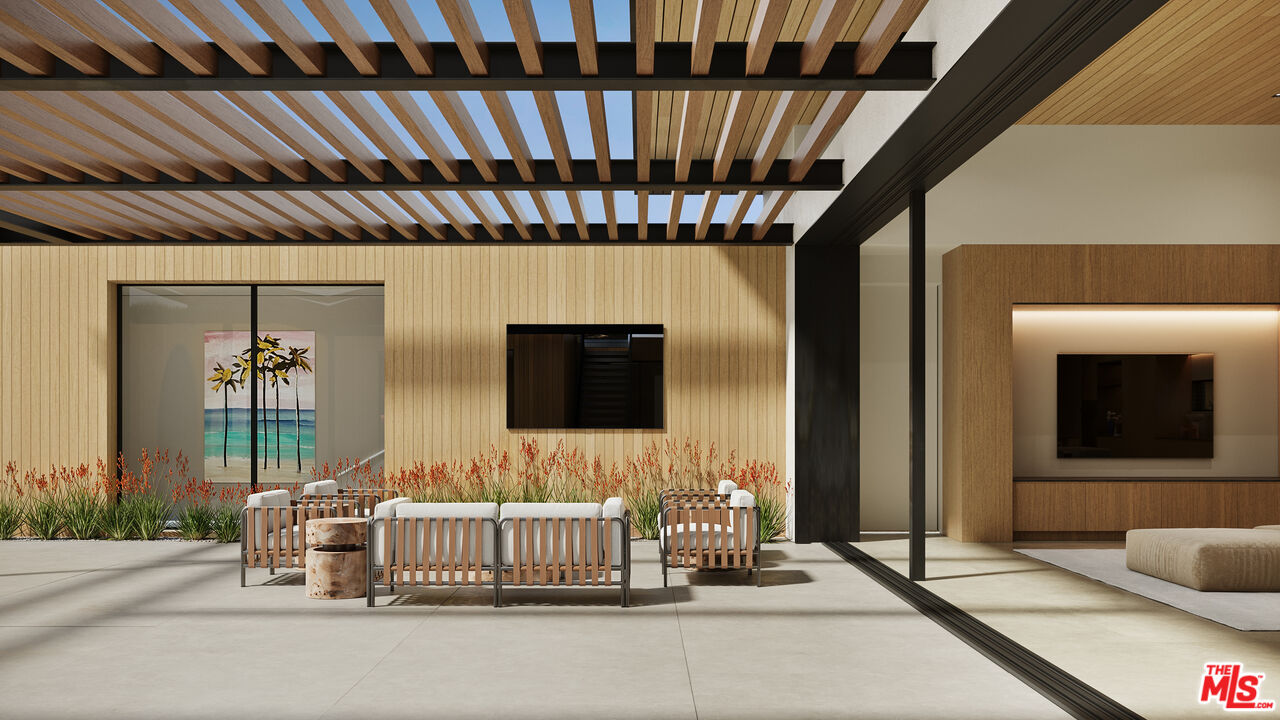 29636 Cuthbert Road Malibu, CA 90265 - Photo 20 of 30 a bedroom with a bed and a flat screen tv