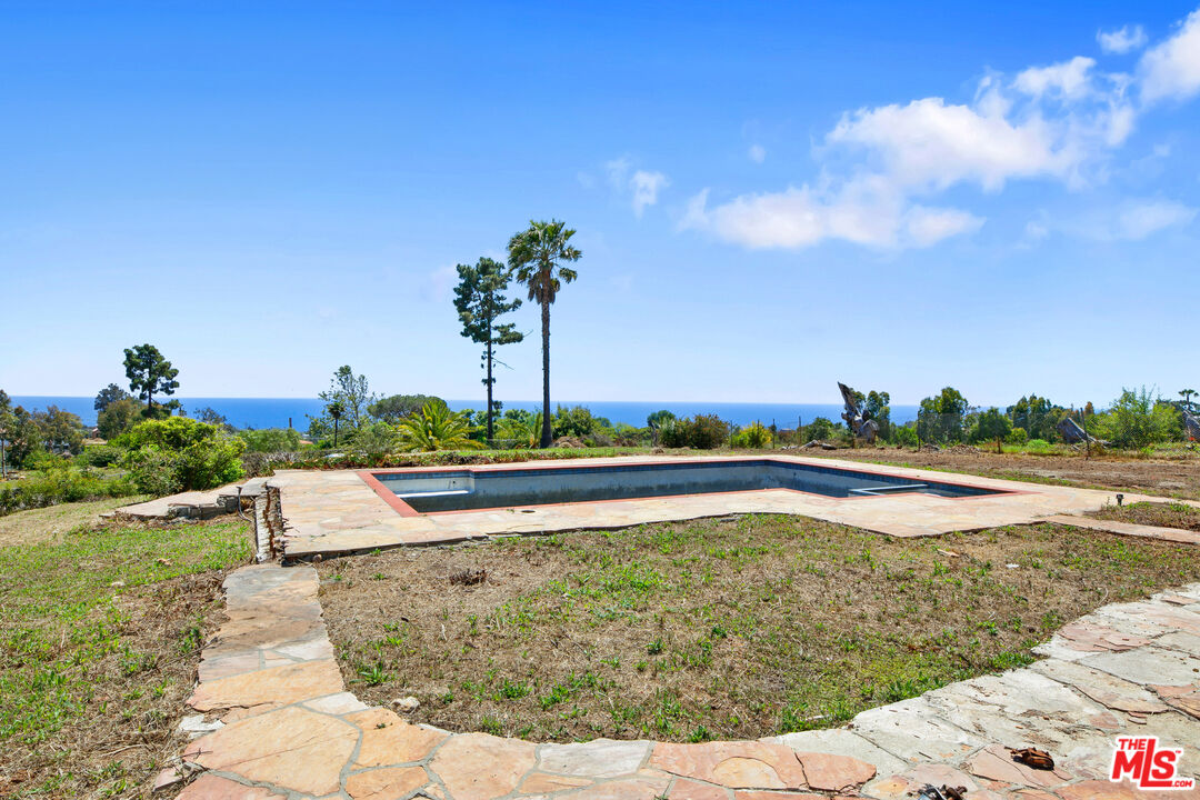 29636 Cuthbert Road Malibu, CA 90265 - Photo 2 of 30 a view of a swimming pool and lake view