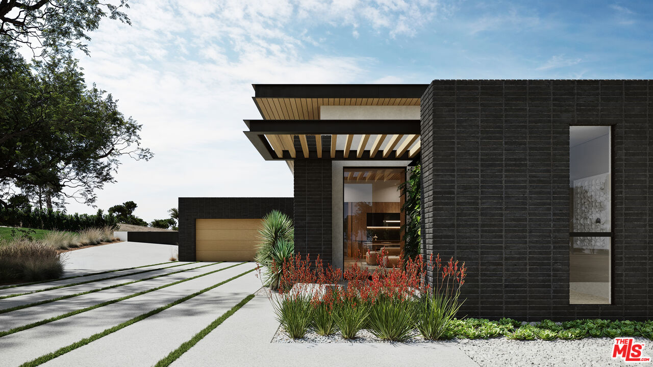 29636 Cuthbert Road Malibu, CA 90265 - Photo 5 of 30 a front view of a house with garden