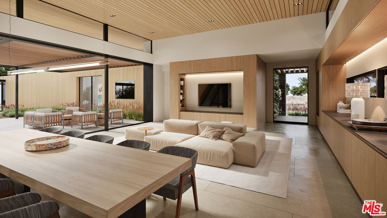 29636 Cuthbert Road Malibu, CA 90265 - Photo 6 of 30 a living room with furniture and a flat screen tv