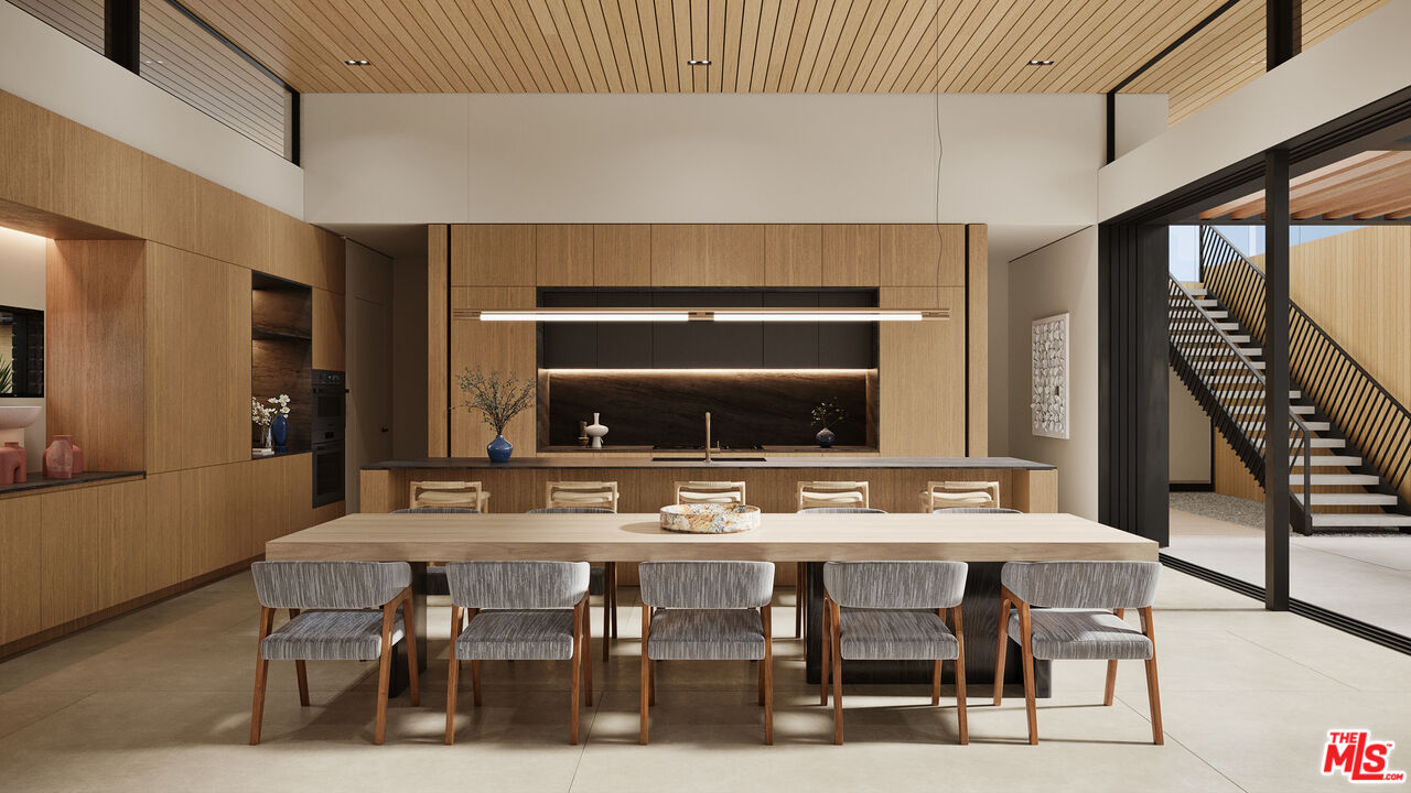 29636 Cuthbert Road Malibu, CA 90265 - Photo 7 of 30 a kitchen with a table and chairs in it
