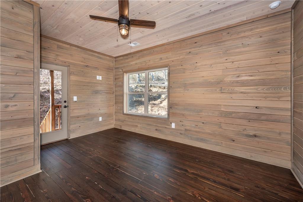 1041 Astro Court Northeast Ranger, GA 30734 - Photo 26 of 52 wooden floor in an empty room with a window
