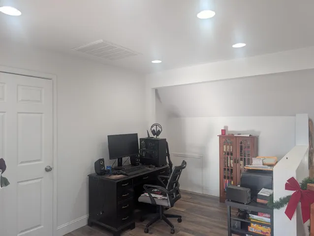 a view of a workspace with furniture