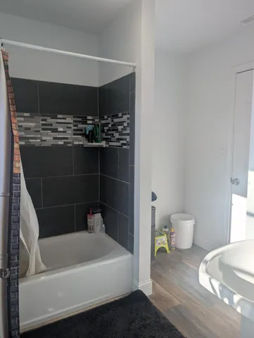 a bathroom with a bathtub and toilet