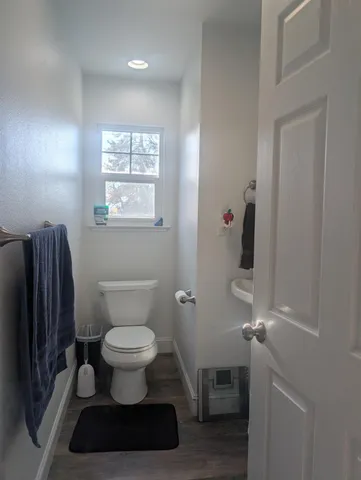 a bathroom with a toilet and a shower