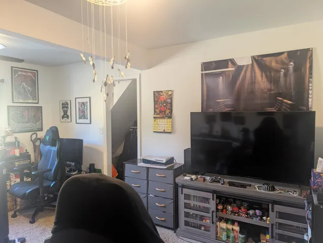 a bedroom with furniture and a closet