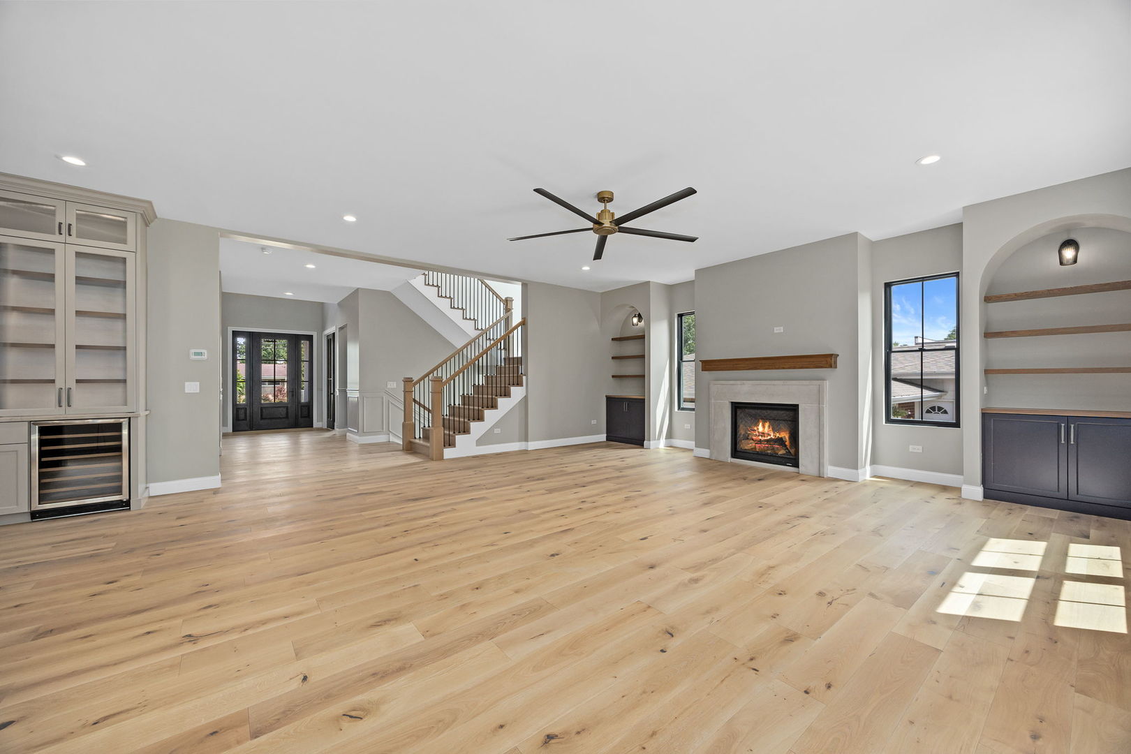 1-s710 Shaffner Road Wheaton, IL 60189 - Photo 11 of 19 an empty room with fireplace wooden floor and windows