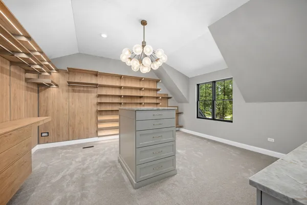 a view of a storage & utility room with a window