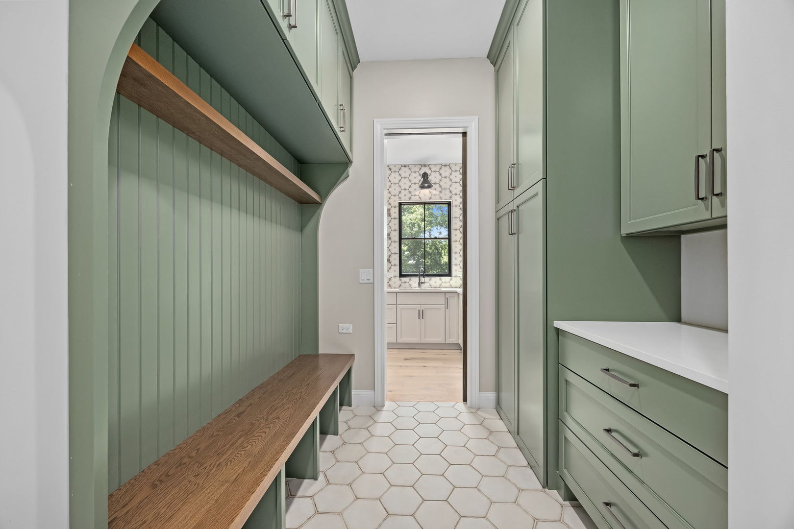 1-s710 Shaffner Road Wheaton, IL 60189 - Photo 18 of 19 a view of hallway with cabinets and wooden floor