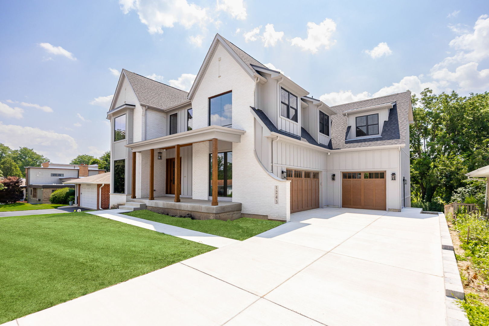 1-s710 Shaffner Road Wheaton, IL 60189 - Photo 2 of 19 a front view of a house with a yard and potted plants