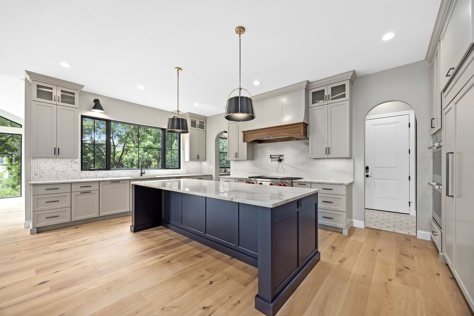1-s710 Shaffner Road Wheaton, IL 60189 - Photo 5 of 19 a kitchen with stainless steel appliances granite countertop a stove a sink dishwasher a refrigerator and white cabinets with wooden floor