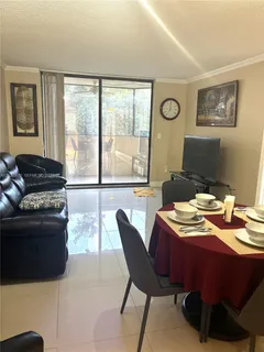 a reading room with furniture and a window