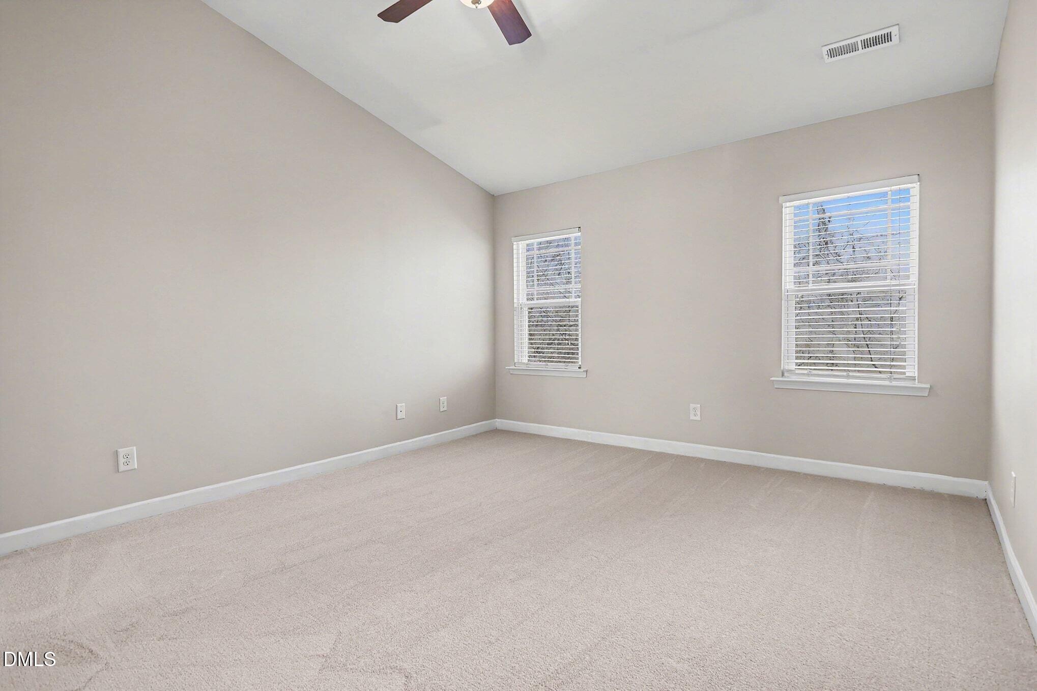 4818 Landover Bluff Way Raleigh, NC 27616 - Photo 18 of 30 an empty room with windows